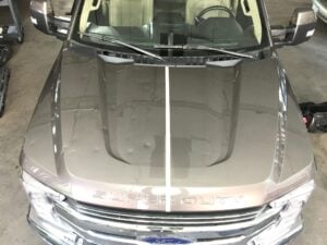 Before and after photo of hail damage repair in Duluth using PDR
